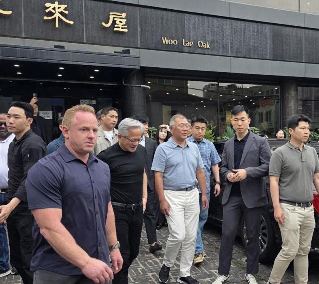 Nvidias CEO Jensen Huang leaves a restaurant in central Seoul after having lunch with Hyundai Motor Group chairman Chung Eui-sun on June 7 2026 Yonhap