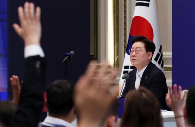 President Lee Jae-myung responds to questions from reporters during a press conference marking his first anniversary in office at the Blue House on June 8, 2026.