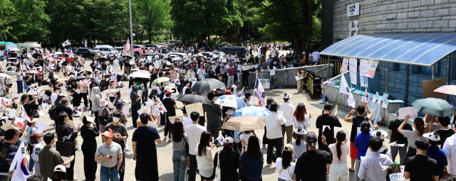 A protester rests on a bench inside Olympic Park in Songpa-gu Seoul on June 8 2026 AJP Han Jun-gu