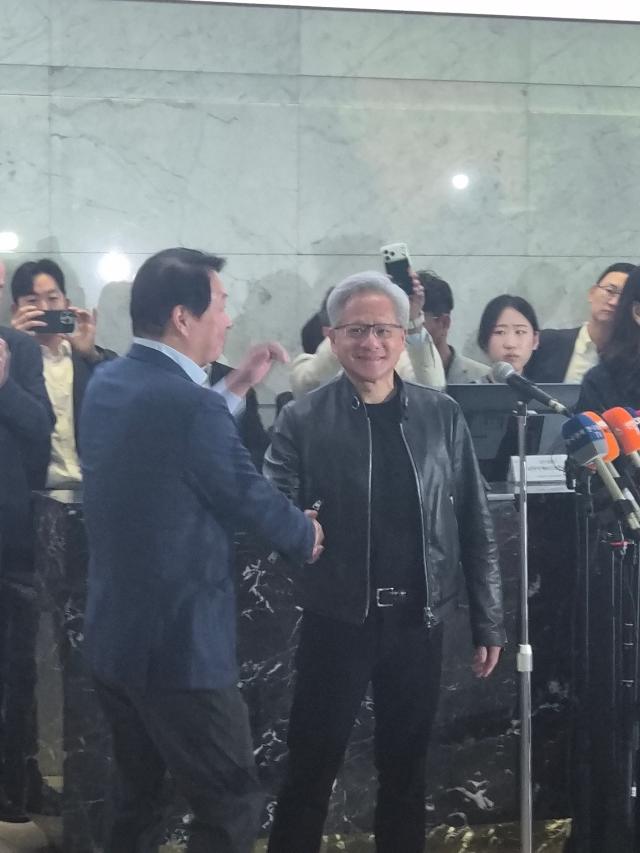 Tony Chey and Jensen Huang shake hands after announcing Nvidia and SKs long term  AJP Candice Kim