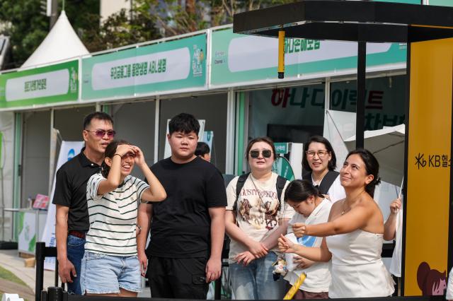 Visitors and foreign tourists explore exhibition booths during the 2026 Seoul Health Show at Seoul Plaza in central Seoul on June 9 2026 AJP Yoo Na-hyun