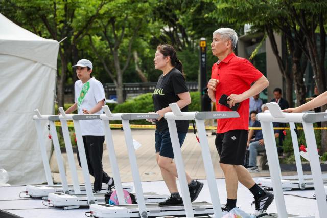 Visitors and foreign tourists explore exhibition booths during the 2026 Seoul Health Show at Seoul Plaza in central Seoul on June 9 2026 AJP Yoo Na-hyun


