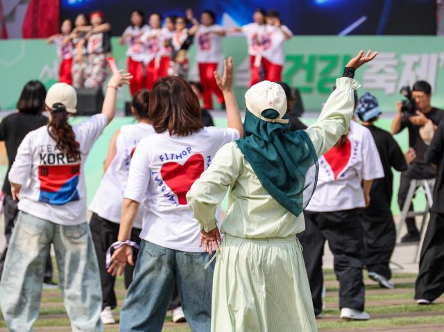 Visitors and foreign tourists explore exhibition booths during the 2026 Seoul Health Show at Seoul Plaza in central Seoul on June 9 2026 AJP Yoo Na-hyun


