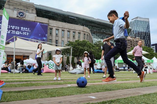 Visitors and foreign tourists explore exhibition booths during the 2026 Seoul Health Show at Seoul Plaza in central Seoul on June 9 2026 AJP Yoo Na-hyun



