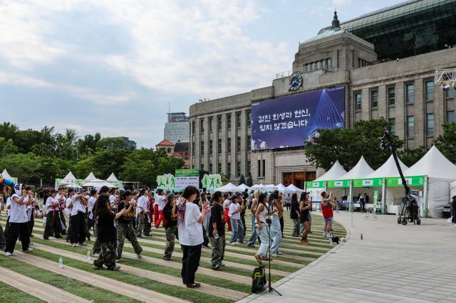 Visitors and foreign tourists explore exhibition booths during the 2026 Seoul Health Show at Seoul Plaza in central Seoul on June 9 2026 AJP Yoo Na-hyun