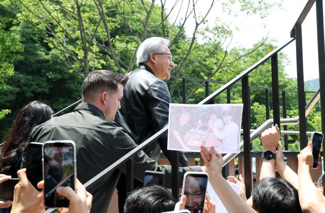 Nvidia CEO Jensen Huang is greeted by students during a visit to the College of Engineering at Seoul National University in Seoul on June 8 2026 AJP Yoo Na-hyun