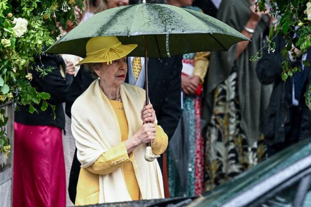 Princess Anne holds an umbrella outside All Saints Church following the wedding of her son Peter Phillips and Harriet Sperling in Kemble Cirencester Britain June 6 2026 Reuters-Yonhap 