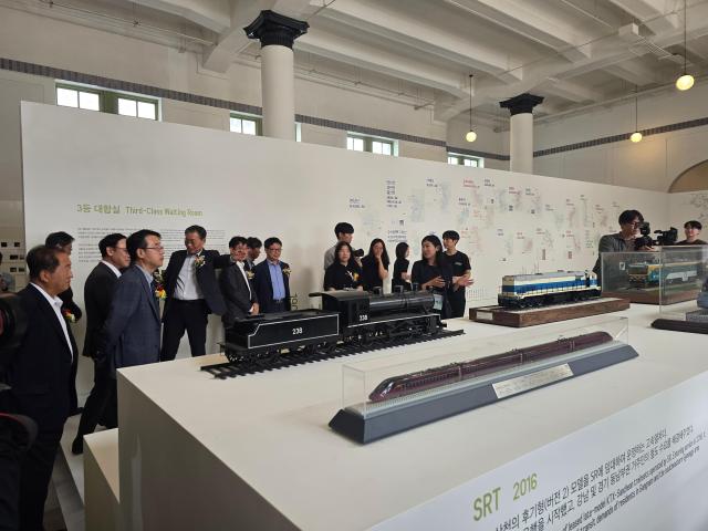 Key guests tour the exhibition with a docent.