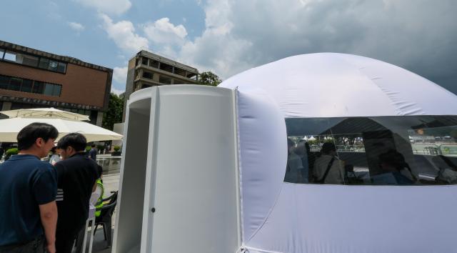An outdoor heat-relief shelter known as Happyso featuring an air-conditioned dome structure is in operation at Gwanghwamun Square in central Seoul on June 11 2026 AJP Yoo Na-hyun