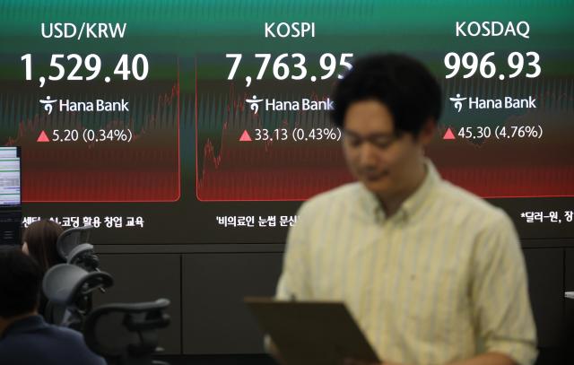 A stock board shows the stock indices and exchange rate session at a Hana Bank dealing room in Seoul on Thursday June 11 2026