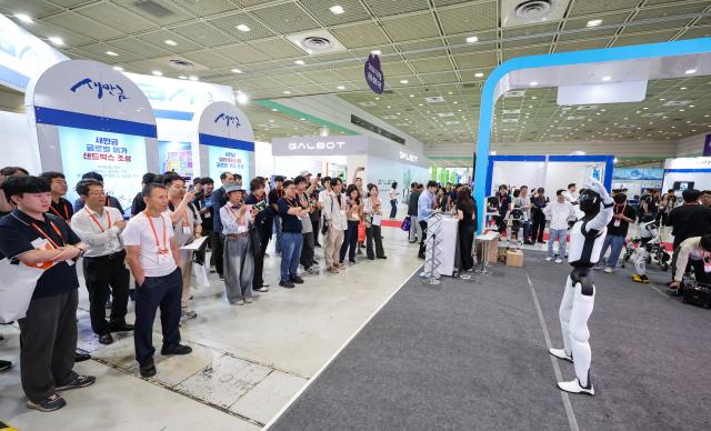 Visitors explore exhibits at Smart Tech Korea 2026 at COEX in Seouls Gangnam District on June 11 2026 