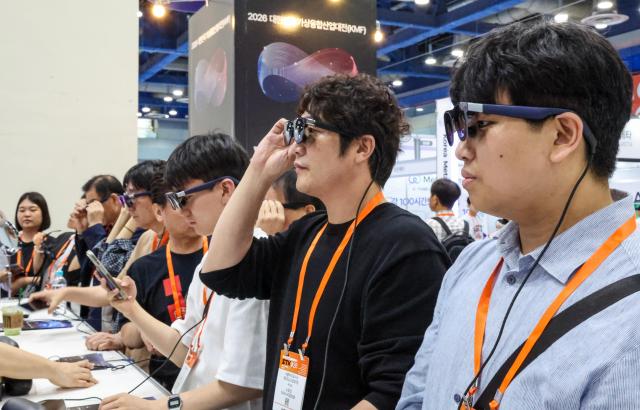 Visitors explore exhibits at Smart Tech Korea 2026 at COEX in Seouls Gangnam District on June 11 2026 