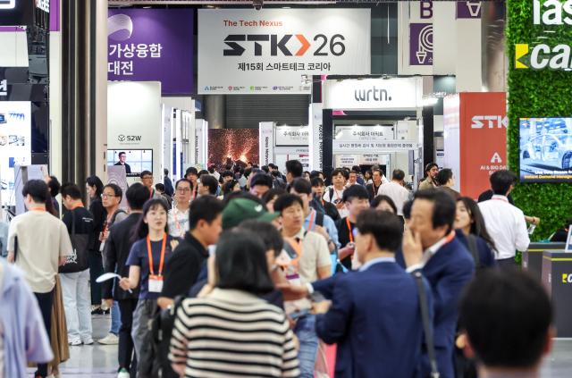 Visitors explore exhibits at Smart Tech Korea 2026 at COEX in Seouls Gangnam District on June 11 2026 

