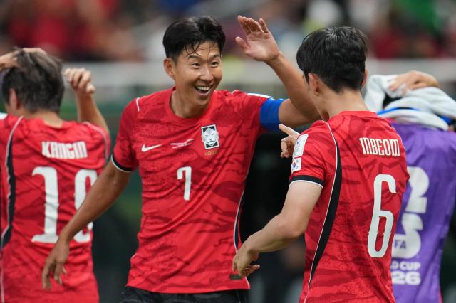 South Koreas Son Heung-min congratulates teammate Hwang In-beom right after he scored their first goal during the World Cup Group A soccer match between South Korea and Czechia in Zapopan near Guadalajara Mexico Thursday June 11 2026 APYonhap