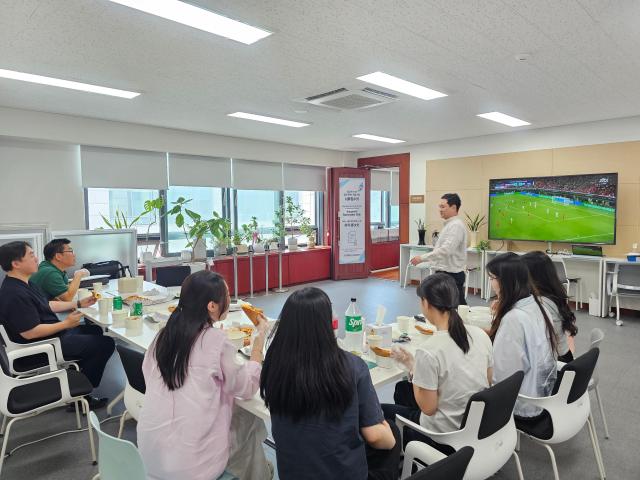 This photo provided by Gachon University faculty member show their way of chanting for the Korean football team