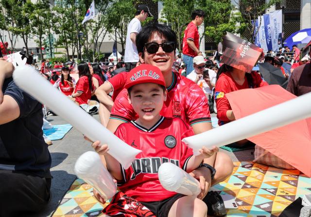 Supporters cheer while watching South Korea's Group A match against the Czechia Republic during a public viewing event for the 2026 FIFA World Cup at Gwanghwamun Square in Seoul on June 12. AJP Yoo Na-hyun


