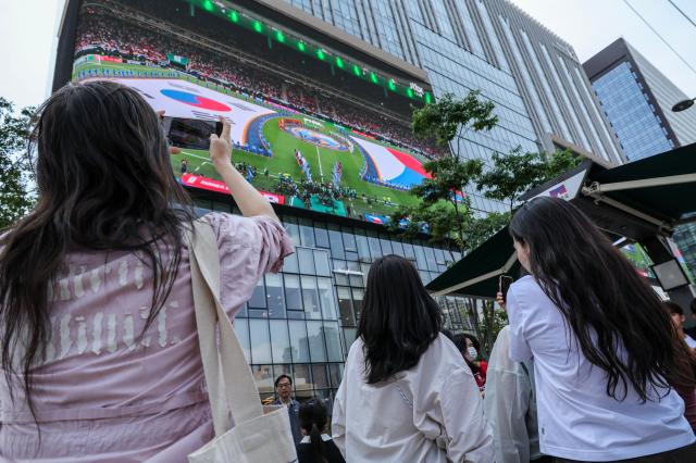 Supporters cheer while watching South Koreas Group A match against the Czechia Republic during a public viewing event for the 2026 FIFA World Cup at Gwanghwamun Square in Seoul on June 12 AJP Yoo Na-hyun