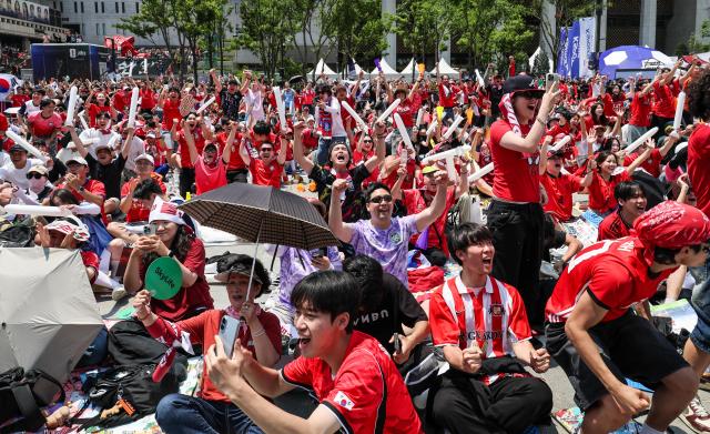 Supporters cheer while watching South Koreas Group A match against the Czechia Republic during a public viewing event for the 2026 FIFA World Cup at Gwanghwamun Square in Seoul on June 12 AJP Yoo Na-hyun

