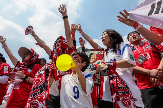 Supporters cheer while watching South Koreas Group A match against the Czechia Republic during a public viewing event for the 2026 FIFA World Cup at Gwanghwamun Square in Seoul on June 12 AJP Yoo Na-hyun

