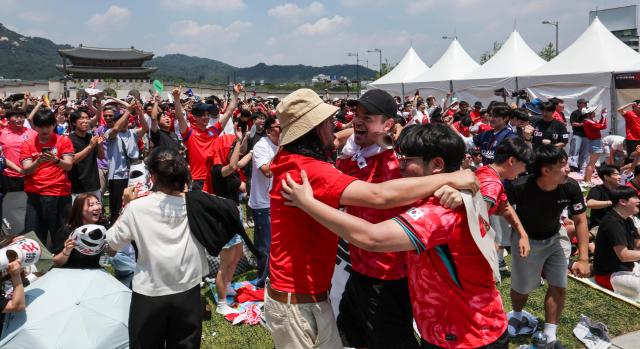 Supporters cheer while watching South Koreas Group A match against the Czechia Republic during a public viewing event for the 2026 FIFA World Cup at Gwanghwamun Square in Seoul on June 12 AJP Yoo Na-hyun

