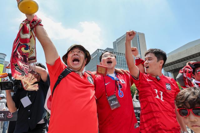 Supporters cheer while watching South Koreas Group A match against the Czechia Republic during a public viewing event for the 2026 FIFA World Cup at Gwanghwamun Square in Seoul on June 12 AJP Yoo Na-hyun

