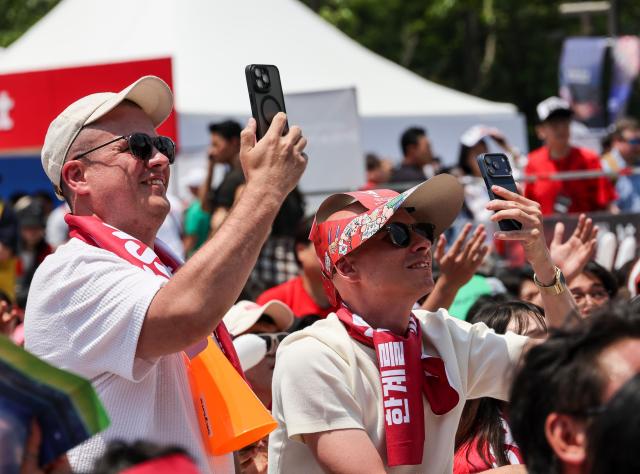 Supporters cheer while watching South Koreas Group A match against the Czechia Republic during a public viewing event for the 2026 FIFA World Cup at Gwanghwamun Square in Seoul on June 12 AJP Yoo Na-hyun


