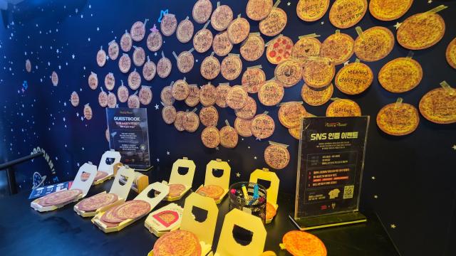 A corner of the Papa John's Pizza Planet pop-up store in Seongsu-dong, Seoul, featuring the 'Write to My Andy' program.