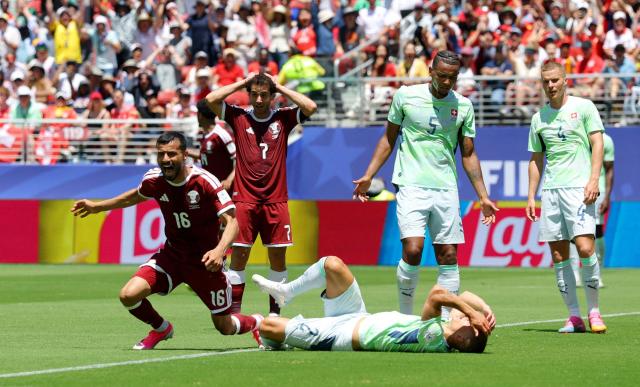 Qatars Boualem Khoukhi celebrates after scoring a dramatic stoppage-time equalizer during a Group B match against Switzerland at Levis Stadium in Santa Clara California on June 13 2026 ReutersYonhap
