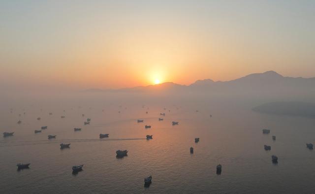 A drone view shows vessels in the Strait of Hormuz as seen from Musandam Oman June 15 2026 REUTERSYonhap