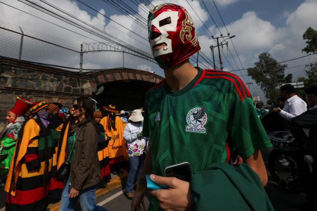 Fans undergo ticket checks before the opening match of the World Cup in Mexico City on June 11.