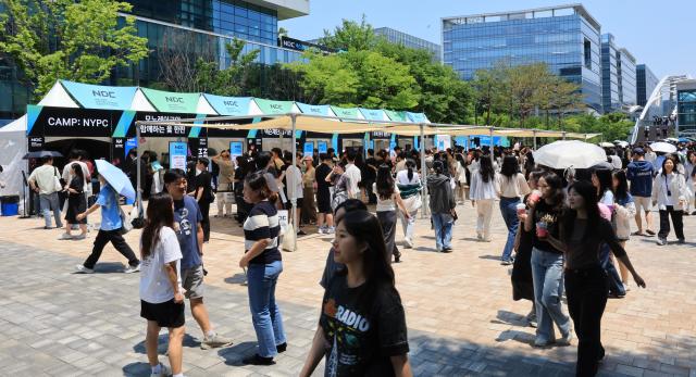 Visitors at the 19th Nexon Developers Conference wait in line for event pop-ups at Nexon Korea headquarters in Seongnam June 16 2026 AJP Han Jun-gu