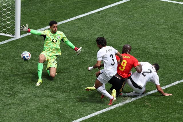 Belgiums Romelu Lukaku battles for the ball before helping force an own goal by Egypts Mohamed Hany during a Group G match at Seattle Stadium in Seattle Washington on June 15 2026 APYonhap