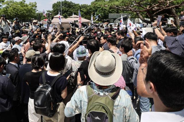 Jang Dong-hyeok the leader of the main opposition People Power Party PPP is caught in a crowd of protesters at a rally in southern Seoul on June 16 2026 AJP Yoo Na-hyun