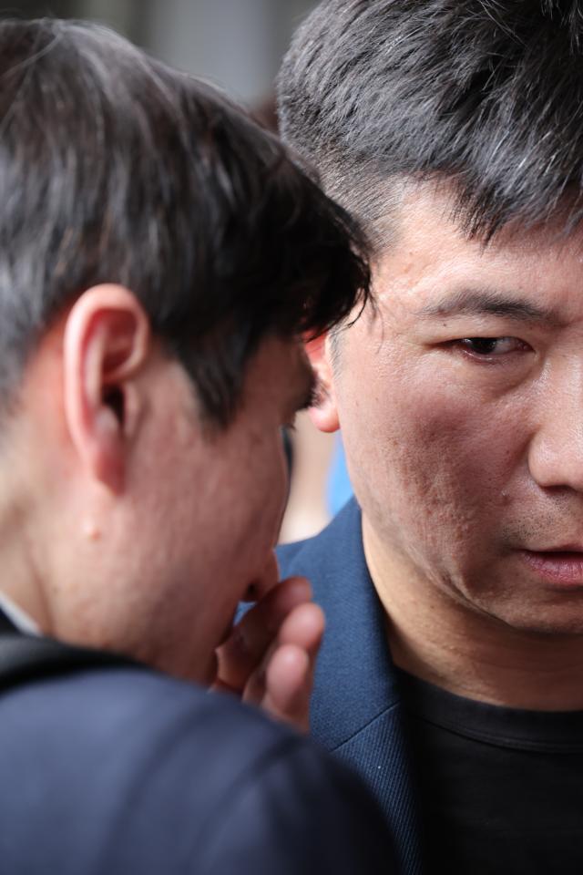 Yu Seung-min president of the Korea Sports Council waits outside the Olympic Handball Gymnasium in Seouls Olympic Park on June 16 as protesters continue a blockade demonstration around the vote-counting center over ballot shortages reported during South Koreas June 3 local elections AJP Yoo Na-hyun
