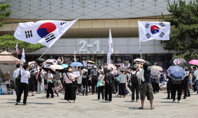 Protesters continue a blockade demonstration outside the Olympic Handball Gymnasium in Seouls Olympic Park on June 16 denouncing ballot shortages reported during South Koreas June 3 local elections AJP Yoo Na-hyun


