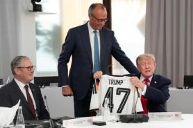 German Chancellor Merz Gifts Trump Soccer Jersey to Mend Relations