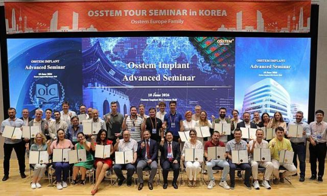 European dentists participating in the Osstem Europe Tour Seminar 2026 receive certificates after the seminar held on June 10 at Osstem Implant Twin Tower in Gangseo-gu, Seoul.