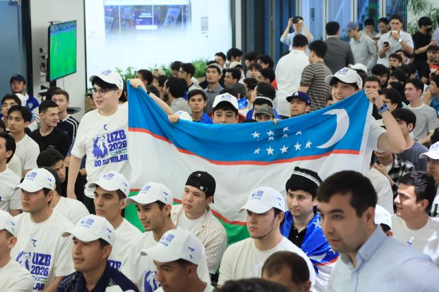 Uzbekistani residents in South Korea wave national flags at the basement of S Tower in Seongsu-dong Seongdong-gu Seoul on June 18 2026 AJP Han Jun-gu