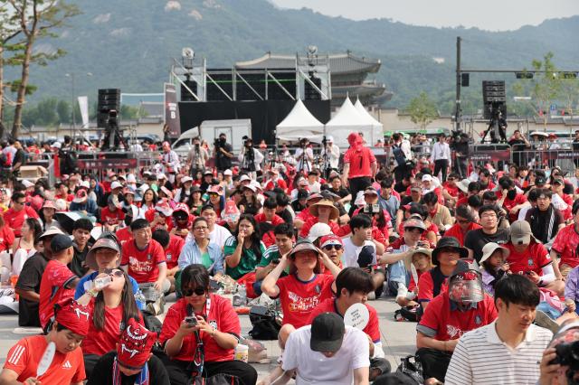 Crowds occupy space around big screens set up at Gwanghwamun square in downtown Seoul for the Korea-Mexico World Cup match on June 19 2026 AJP Yoo Na-hyun