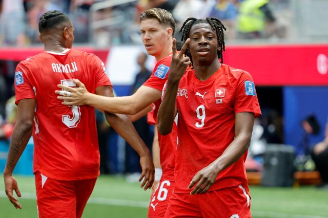 Canadas Jonathan David left celebrates with a teammate after scoring during a Group B match against Qatar at BC Place Vancouver in Vancouver Canada on June 18 2026 AFPYonhap