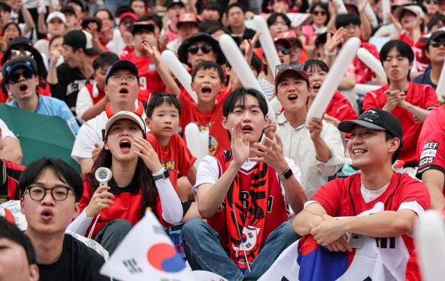 South Korean football fans cheer while watching the Group A match between South Korea and Mexico at a public viewing event at Gwanghwamun Square in Seoul on June 19 2026 during the 2026 FIFA World Cup AJP Yoo Na-hyun