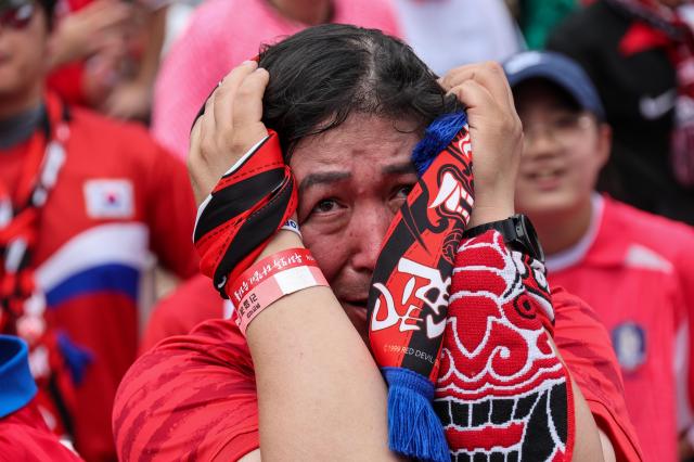 South Korean football fans cheer while watching the Group A match between South Korea and Mexico at a public viewing event at Gwanghwamun Square in Seoul on June 19, 2026, during the 2026 FIFA World Cup. AJP Yoo Na-hyun
