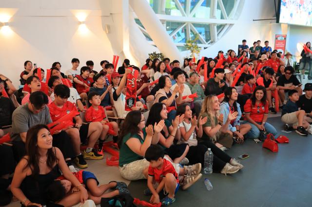 South Korean football fans cheer while watching the Group A match between South Korea and Mexico at a public viewing event at Hangang Play Place in Ttukseom Hangang Park in Seoul on June 19 2026 during the 2026 FIFA World Cup AJP Han Jun-gu
