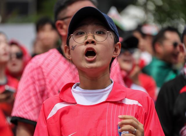 South Korean football fans cheer while watching the Group A match between South Korea and Mexico at a public viewing event at Gwanghwamun Square in Seoul on June 19 2026 during the 2026 FIFA World Cup AJP Yoo Na-hyun
