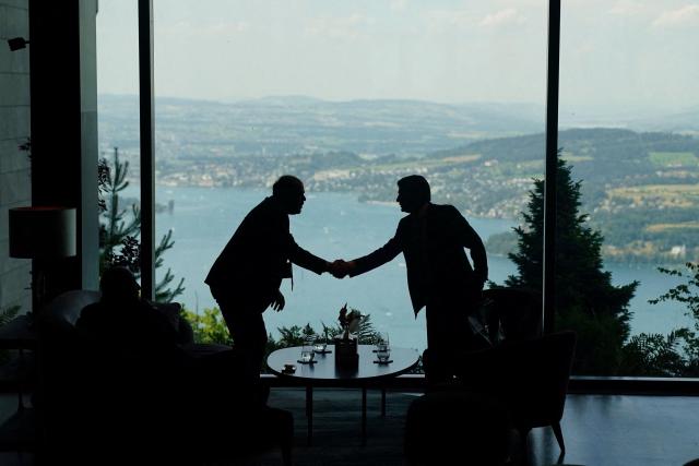 Delegation staff members meet in the lobby on the day of a quadrilateral meeting between the United States Iran Pakistan and Qatar at the Burgenstock luxury hotel complex overlooking Lake Lucerne Switzerland on June 21 2026 as part of high-level talks aimed at advancing a deal to end the Middle East conflict that has weighed over the global economy for nearly four months 
AFPYonhap