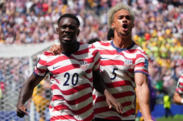 United States Folarin Balogun left and Antonee Robinson celebrate after Balogun forced an own goal during a Group D match against Australia at Seattle Stadium in Seattle Washington on June 19 2026 APYonhap