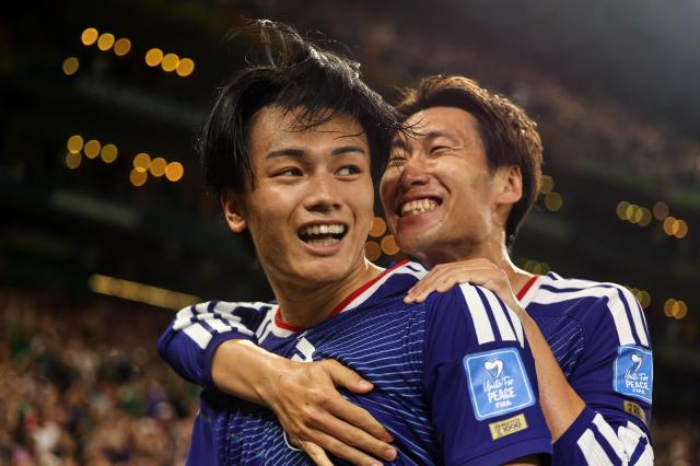 Japans Ayase Ueda left celebrates after scoring during a Group F match against Tunisia at Estadio Monterrey in Monterrey Mexico on June 21 2026 Ueda finished with two goals and an assist APYonhap