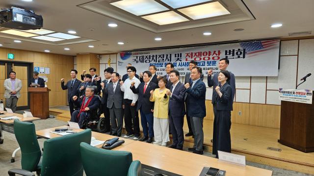 Participants pose for a commemorative photo during a forum on international security and changing patterns of warfare at the National Assembly Members’ Office Building in Seoul on June 22 2026 AJP Lee Jung-woo 