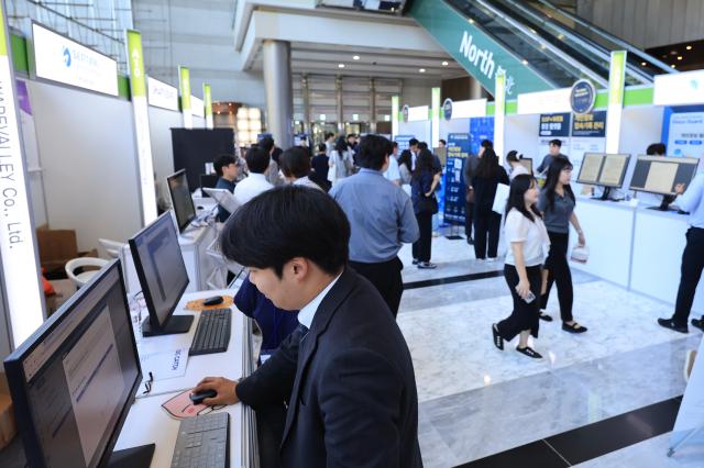 Visitors browse exhibition booths at the Personal Information Security Fair  CPO Workshop held at COEX in Seoul on June 23 2026 AJP Han Jun-gu