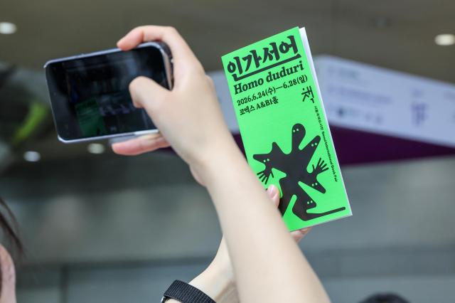 Visitors pose for commemorative photos during the 2026 Seoul International Book Fair at COEX in Gangnam-gu, Seoul, on June 23, 2026. AJP Yoo Na-hyun